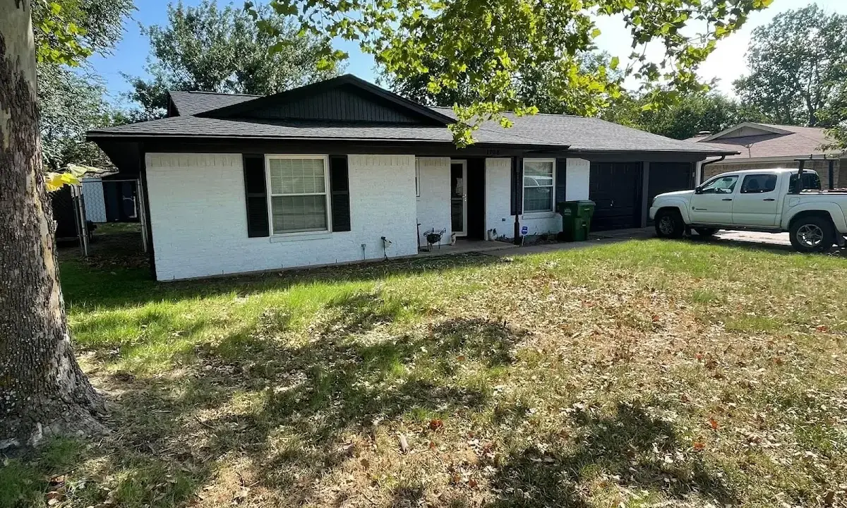 Professional roofing crew working on a residential roof in Brooklyn Center
